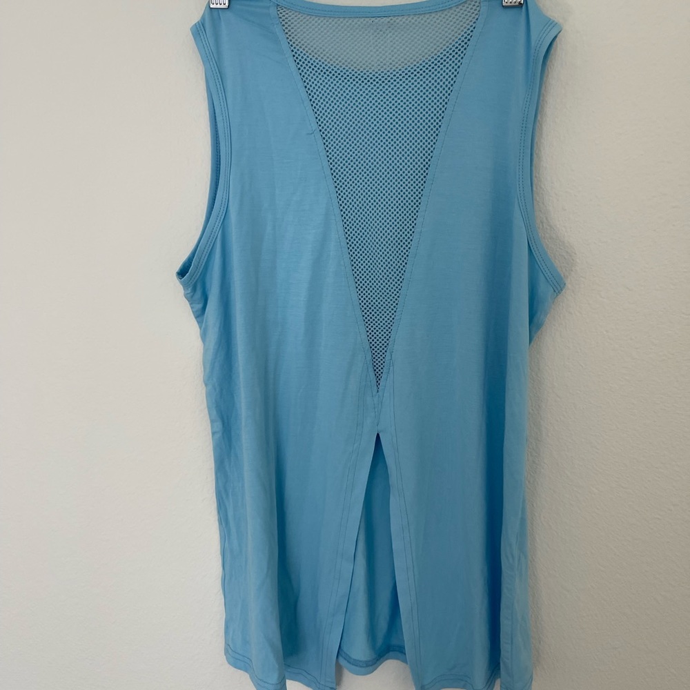 Workout top. Super cute back. Brand new with tags!